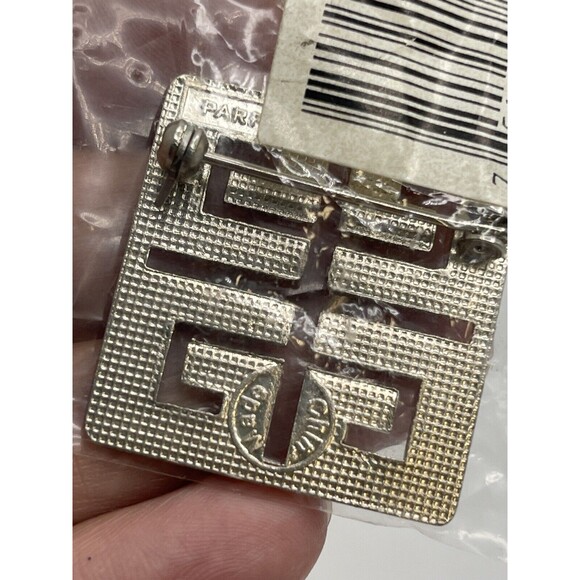 Vintage Givenchy Parfums Silvertone Purple Enamel Logo Pin Brooch New - Picture 7 of 8